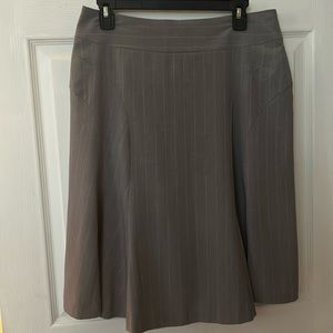 Worthington stretch gray w/white stripe. Has built in slip.